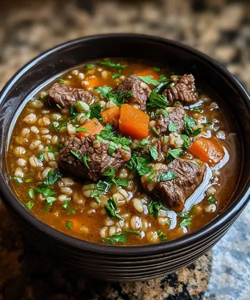 Hearty beef barley soup with tender beef and carrots