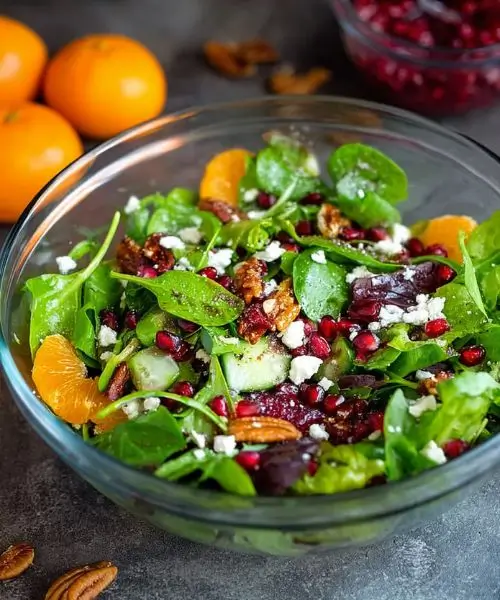 easy christmas salad with mandarin oranges pomegranate feta and candied pecans