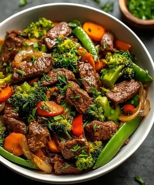 beef stir fry with broccoli carrots snap peas and bell peppers