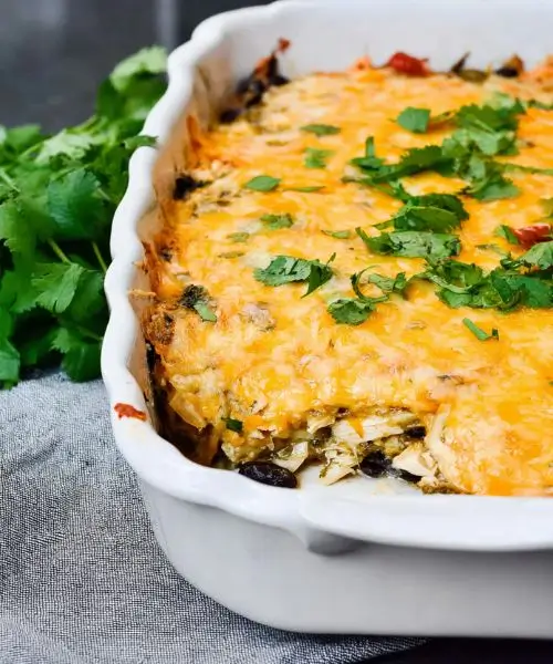 healthy salsa verde chicken casserole baked with melted cheese and cilantro