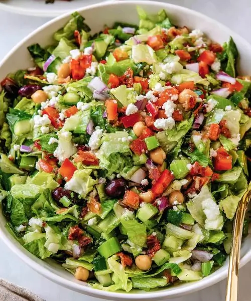 Ruth Chris Chopped Salad with romaine lettuce, chickpeas, cucumber, tomatoes, olives and feta cheese